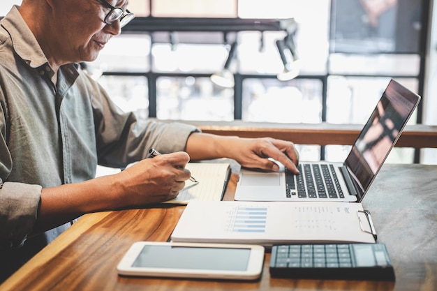 Job costing documentation and project cost spreadsheets on a construction desk